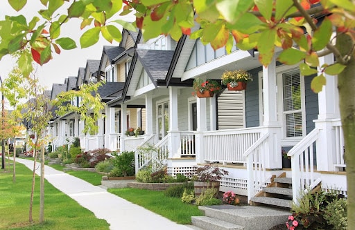 A row of craftsman homes with front porches