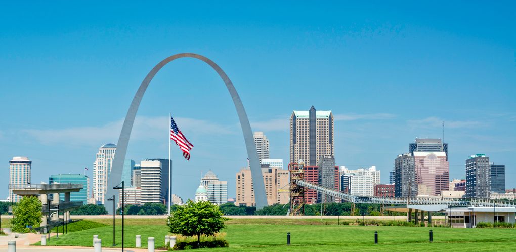 St. Louis skyline with the Gateway Arch and American flag